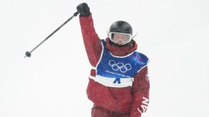 Canada's Megan Oldham pumps her fist as she comes into the finish zone following her first run in the women's free ski big air at the Milan Cortina 2026 Winter Olympic Games in Livigno, Italy on Monday, Feb. 16, 2026. (Sean Kilpatrick/THE CANADIAN PRESS)
