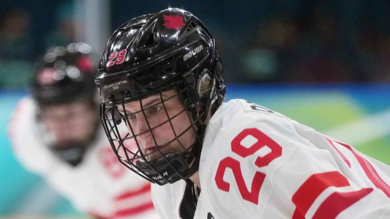 Canada’s Marie-Philip Poulin (29) waits to take a face-off during the first period of a preliminary round women's hockey game at the Milan Cortina Winter Olympics, in Milan. (Darryl Dyck/THE CANADIAN PRESS)