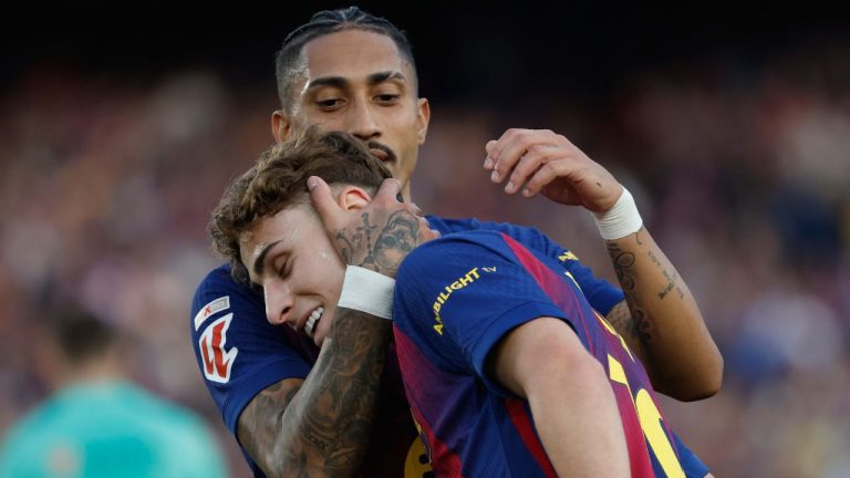 Barcelona's Raphinha hugs Fermin Lopez after a goal during a La Liga soccer match between Barcelona and Levante in Barcelona, Spain, Sunday, Feb. 22, 2026. (Joan Monfort/AP)