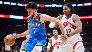 Oklahoma City Thunder's Chet Holmgren (7) drives against Toronto Raptors' Collin Murray-Boyles (12) during first half NBA basketball action in Toronto, on Tuesday, Feb. 24, 2026. (Sammy Kogan/CP)