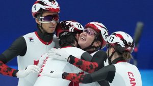 Team Canada celebrates after winning a silver in the team mixed relay short track speed skating at the 2026 Winter Olympics, in Milan, Italy, Tuesday, Feb. 10, 2026. (Darryl Dyck/THE CANADIAN PRESS)
