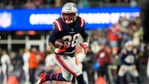 New England Patriots running back Rhamondre Stevenson runs for a touchdown during the second half of an NFL game against the Miami Dolphins in Foxborough, Mass., Sunday, Jan. 4, 2026. (AP/Robert F. Bukaty)