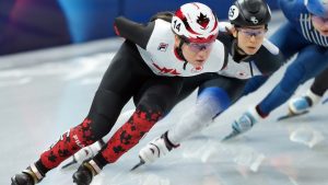 Canada's Courtney Sarault competes in the women's 1000m Short Track Speed Skating event during the 2026 Milan Cortina Winter Olympics in Milan, Italy on Saturday, February 14, 2026. (Nathan Denette/THE CANADIAN PRESS)