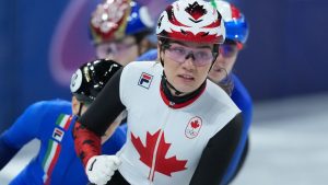 Canada's Courtney Sarault pumps her fist after winning the women's 1,000 metre short track speedskating semi-finals at the 2026 Winter Olympics, in Milan, on Monday, February 16, 2026. (Darryl Dyck/THE CANADIAN PRESS)