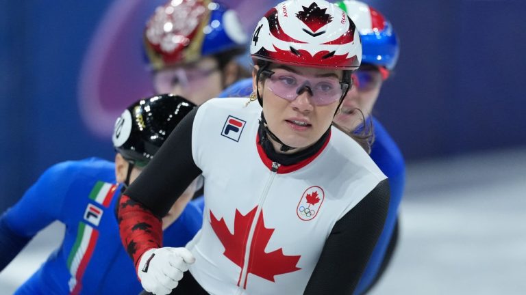 Canada's Courtney Sarault pumps her fist after winning the women's 1,000 metre short track speedskating semi-finals at the 2026 Winter Olympics, in Milan, on Monday, February 16, 2026. (Darryl Dyck/THE CANADIAN PRESS)