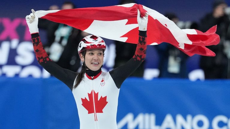 Canada's Courtney Sarault celebrates winning the silver medal in the women's 1,000 metre short track speedskating finals at the 2026 Winter Olympics, in Milan, on Monday, February 16, 2026. (Darryl Dyck/THE CANADIAN PRESS)