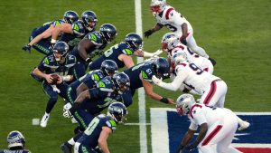 The Seattle Seahawks and the New England Patriots, right, face off during the first half of the NFL Super Bowl 60 football game, Sunday, Feb. 8, 2026, in Santa Clara, Calif. (Charlie Riedel/AP)