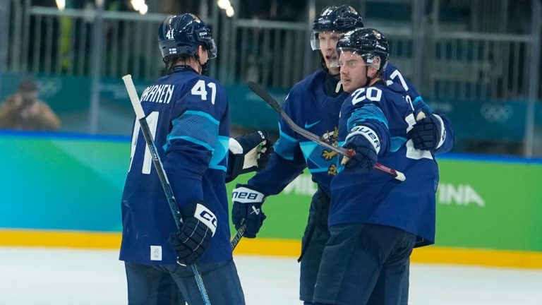 Finland's Sebastian Aho (20) celebrates scoring his side's first goal during a men's ice hockey quarterfinal game between Finland and Switzerland at the 2026 Winter Olympics, in Milan, Italy, Wednesday, Feb. 18, 2026. (Petr David Josek/AP)