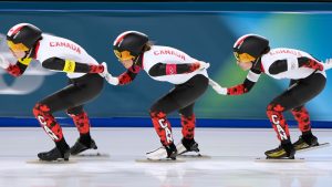 Team Canada is led by Isabelle Weidemann, followed by Valerie Maltais, centre, and Ivanie Blondin, right, as they compete in the women's team pursuit quarterfinals speedskating race at the 2026 Winter Olympics, in Milan, Italy, Saturday, Feb. 14, 2026. (Ben Curtis/AP Photo)