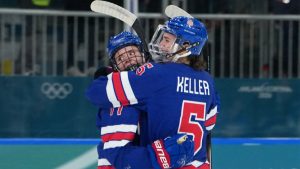 United States' Britta Curl (17) celebrates with Megan Keller (5) after Curl scored a goal against Italy during the second period of a women's ice hockey quarterfinal match at the 2026 Winter Olympics, in Milan, Italy, Friday, Feb. 13, 2026. (Carolyn Kaster/AP Photo)