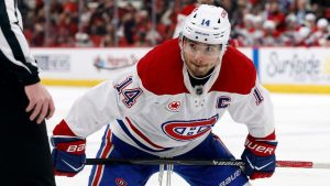 Montréal Canadiens' Nick Suzuki (14) watches the puck against the Carolina Hurricanes during the third period of an NHL hockey game in Raleigh, N.C., Thursday, Jan. 1, 2026. (Karl DeBlaker/AP)