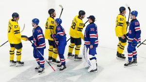 United States and Sweden players shake hands after the United States' overtime win in a men's ice hockey quarterfinal game at the 2026 Winter Olympics, in Milan, Italy, Wednesday, Feb. 18, 2026. (Hassan Ammar/AP)