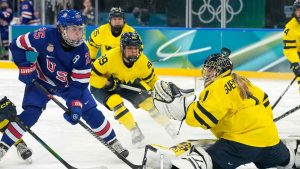 United States' Alex Carpenter (25) shoots during a women's ice hockey semifinal game between the United States and Sweden at the 2026 Winter Olympics. (Hassan Ammar/AP)