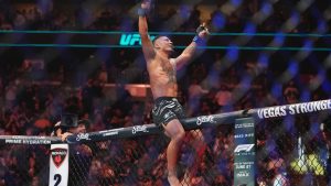 Myanmar's Joshua Van celebrates after stopping Brazil's Bruno Silva during the third round of a light featherweight bout at the UFC 316 mixed martial arts event Saturday, June 7, 2025 in Newark, N.J. (AP/Frank Franklin II)