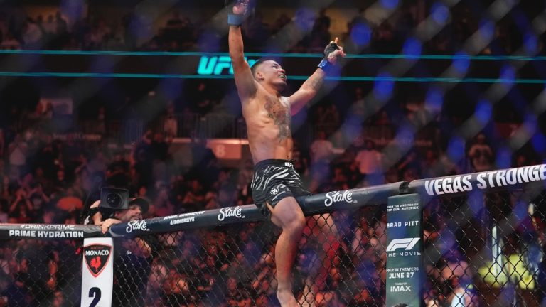 Myanmar's Joshua Van celebrates after stopping Brazil's Bruno Silva during the third round of a light featherweight bout at the UFC 316 mixed martial arts event Saturday, June 7, 2025 in Newark, N.J. (AP/Frank Franklin II)