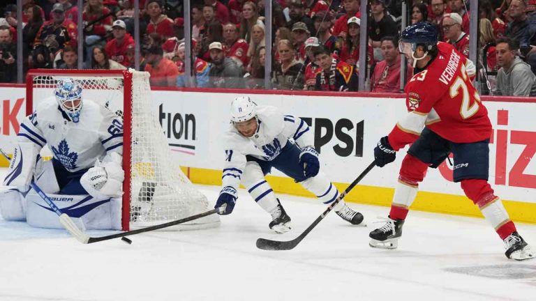 Toronto Maple Leafs goaltender Joseph Woll (60) and center Max Domi (11) defend the goal against Florida Panthers center Carter Verhaeghe (23) during the first period of an NHL game. (Lynne Sladky/AP)
