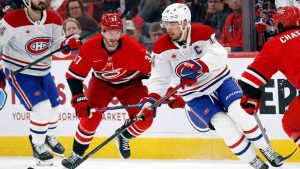 Montréal Canadiens' Nick Suzuki (14) controls the puck against the Montréal Canadiens during the first period of an NHL hockey game in Raleigh, N.C., Sunday, March 29, 2026. (Karl DeBlaker/AP)