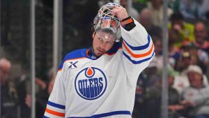Edmonton Oilers goaltender Tristan Jarry lifts his helmet during the first period of an NHL hockey game against the Dallas Stars, Thursday, March 12, 2026, in Dallas. (LM Otero/AP)
