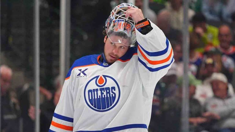 Edmonton Oilers goaltender Tristan Jarry lifts his helmet during the first period of an NHL hockey game against the Dallas Stars, Thursday, March 12, 2026, in Dallas. (LM Otero/AP)