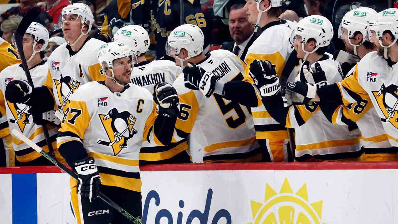 Crosby scores in return, by Penguins fall to Hurricanes in OT