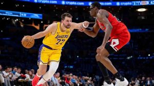 Los Angeles Lakers guard Luka Doncic (77) is defended by Chicago Bulls forward Jalen Smith, right, during the first half of an NBA basketball game against the Chicago Bulls, Thursday, March 12, 2026, in Los Angeles. Los Angeles Lakers guard Luka Doncic (77) is defended by Chicago Bulls forward Jalen Smith, right, during the first half of an NBA basketball game against the Chicago Bulls, Thursday, March 12, 2026, in Los Angeles. (AP Photo/Ethan Swope)