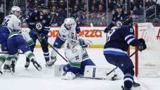 Canucks sunk by Morrissey’s record-setting goal in overtime loss to Jets
