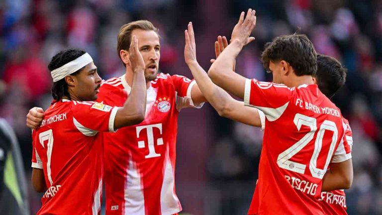 From left, Munich's scorer Serge Gnabry, Harry Kane, Tom Bischof and Raphael Guerreiro celebrate their side's fourth goal during the German Bundesliga soccer match between FC Bayern Munich and 1. FC Union Berlin in Munich, Germany, Saturday, March 21, 2026 (Sven Hoppe/dpa via AP)