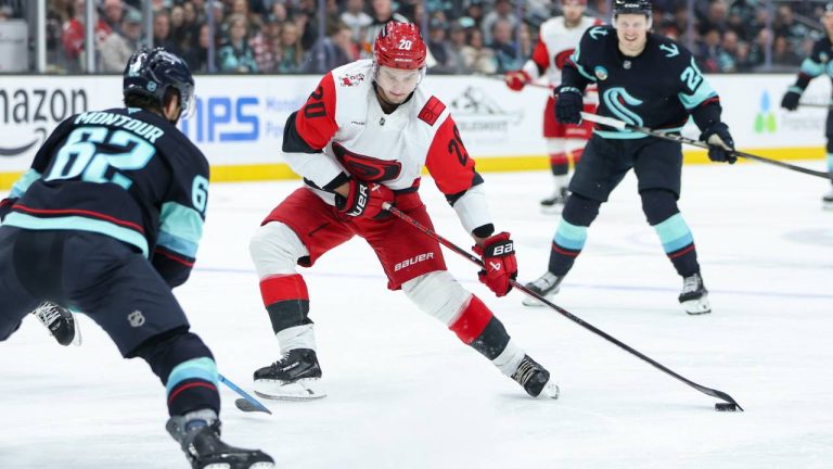 Carolina Hurricanes center, Sebastian Aho (20) controls the puck in the second period against the Seattle Kraken of an NHL hockey game Monday, March 2, 2026, in Seattle. (Kevin Ng/AP)