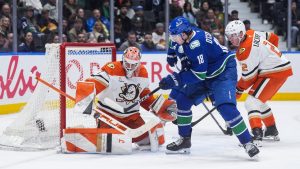 Anaheim Ducks goalie Lukas Dostal (1) stops Vancouver Canucks' Drew O'Connor (18) as Anaheim's Jackson LaCombe (2) watches during the third period of an NHL hockey game, in Vancouver, on Tuesday, March 24, 2026. (Darryl Dyck/CP)