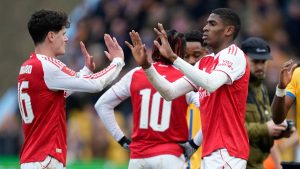 Arsenal's Christian Norgaard, left, and Cristhian Mosquera celebrate after the English FA Cup soccer match between Mansfield Town and Arsenal in Mansfield, England, Saturday, March 7, 2026.(AP Photo/Dave Thompson)