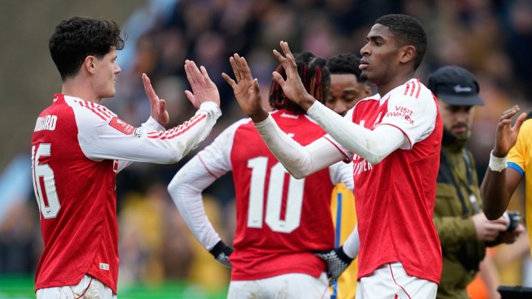 Arsenal's Christian Norgaard, left, and Cristhian Mosquera celebrate after the English FA Cup soccer match between Mansfield Town and Arsenal in Mansfield, England, Saturday, March 7, 2026.(AP Photo/Dave Thompson)