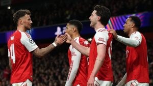 Arsenal's Declan Rice, front, celebrates with teammates after scoring his side's second goal during the second leg of the Champions League round of 16 soccer match between Arsenal and Bayer Leverkusen, in London, Tuesday, March 17, 2026. (Ian Walton/AP)
