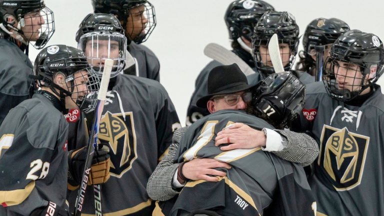 Blackstone Valley Schools head coach Chris Librizzi embraces Colin Dorgan after Dorgan scored the double-overtime game-winning goal against Portsmouth High School in the Rhode Island high school hockey state semifinal, Wednesday, March 11, 2026, at Schneider Arena on the campus of Providence College in Providence, R.I. (Courtesy of T.J. Auclair & Kyle Auclair/Little Big Leaguers Photography via AP)
