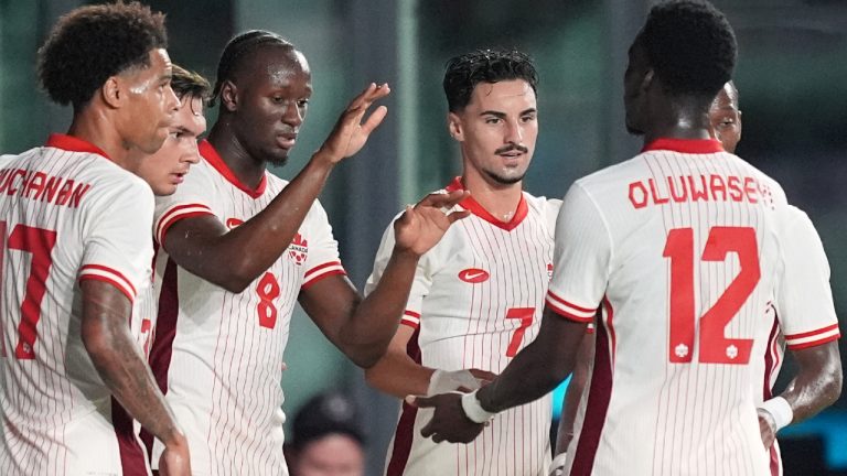 Canada midfielder Ismael Kone (8) celebrates with teammates including midfielder Stephen Eustaquio (7) after scoring his side's first goal against Venezuela during the first half of an international friendly soccer match, Tuesday, Nov. 18, 2025, in Fort Lauderdale, Fla. (Rebecca Blackwell/AP) 
