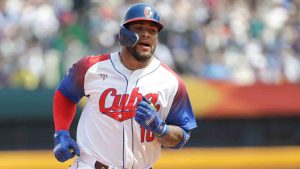 Cuba's player Yoan Moncada runs back to home base to score after his team's 2-run double in the first inning of a Pool A game against Taiwan for the World Baseball Classic (WBC) at Taichung Intercontinental Baseball Stadium in Taichung, Taiwan, Sunday, March 12, 2023. (I-Hwa Cheng/AP)