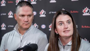 Canada’s National Women’s Team general manager Gina Kingsbury, right, speaks to the media as head coach Troy Ryan looks on at Hockey Canada’s National Teams orientation camp in Calgary, Thursday, Aug. 28, 2025. (Jeff McIntosh/CP)