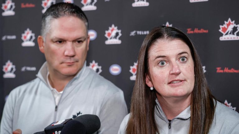 Canada’s National Women’s Team general manager Gina Kingsbury, right, speaks to the media as head coach Troy Ryan looks on at Hockey Canada’s National Teams orientation camp in Calgary, Thursday, Aug. 28, 2025. (Jeff McIntosh/CP)