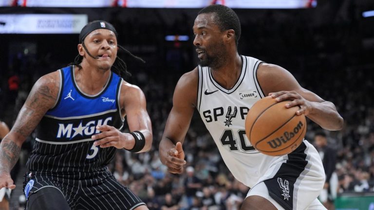 San Antonio Spurs forward Harrison Barnes (40) drives against Orlando Magic forward Paolo Banchero (5) during the second half of an NBA basketball game in San Antonio, Sunday, Feb. 1, 2026. (Eric Gay/AP)