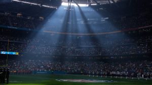 FILE - A shaft of sunlight streams into the stadium before an NFL football game between the Washington Commanders and the Miami Dolphins in Madrid, Spain, Sunday, Nov. 16, 2025. (AP Photo/Manu Fernandez, file)