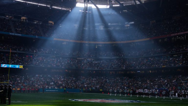 FILE - A shaft of sunlight streams into the stadium before an NFL football game between the Washington Commanders and the Miami Dolphins in Madrid, Spain, Sunday, Nov. 16, 2025. (AP Photo/Manu Fernandez, file)