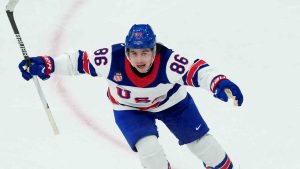 United States' Jack Hughes celebrates after scoring the winning overtime goal against Canada in the men's ice hockey gold medal game at the 2026 Winter Olympics in Milan, Italy, Sunday, Feb. 22, 2026. (Carolyn Kaster/AP)