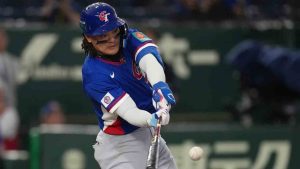Taiwan's Yu Chang hits a single in the third inning of a World Baseball Classic game between Taiwan and Czechia in Tokyo, Saturday, March 7, 2026. (Hiro Komae/AP)