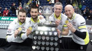 Team Manitoba-Dunstone, from left to right, Matt Dunstone,, Colton Lott , EJ Harnden, Ryan Harden with the Tankard and their gold medals at the Montana's Brier Canadian men's curling championship, in St. John's, N.L., on Sunday, March 8, 2026. THE CANADIAN PRESS/Paul Daly