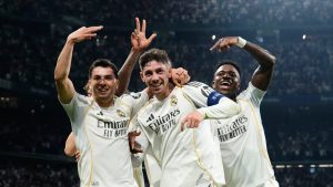 Real Madrid's Federico Valverde, center, celebrates after scoring his third goal during a first leg round of 16 Champions League soccer match between Real Madrid and Manchester City in Madrid, Spain, Wednesday, March 11, 2026. (AP Photo/Jose Breton)