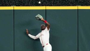 Canada outfielder Denzel Clarke leaps to catch a fly hit by United States first baseman Bryce Harper (24) during the first inning of a World Baseball Classic quarterfinal game, Friday, March 13, 2026, in Houston. (David J. Phillip/AP)