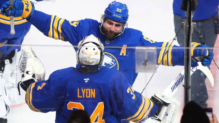 Buffalo Sabres goaltender Alex Lyon (34) and right wing Alex Tuch (89) celebrate after their team's victory following a shootout of an NHL hockey game against the Toronto Maple Leafs, Saturday, March 14, 2026, in Buffalo, N.Y. (Jeffrey T. Barnes/AP)