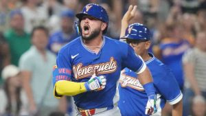 Venezuela's Wilyer Abreu celebrates after he hit a home run during the six inning of a World Baseball Classic quarterfinal game against Japan, Saturday, March 14, 2026, in Miami. (Lynne Sladky/AP)