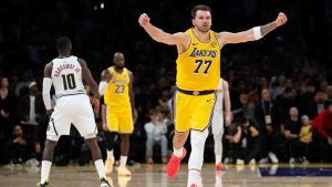 Los Angeles Lakers guard Luka Doncic (77) gestures after the team defeats the Denver Nuggets in an NBA basketball game in Los Angeles, Saturday, March 14, 2026. (Kyusung Gong/AP)