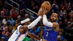 Oklahoma City Thunder guard Shai Gilgeous-Alexander, left, defends against Orlando Magic guard Jevon Carter (2) during the first half of an NBA basketball game, Tuesday, March 17, 2026, in Orlando, Fla. (Kevin Kolczynski/AP)