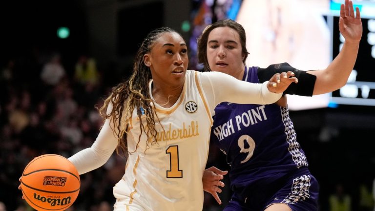 Vanderbilt guard Mikayla Blakes (1) drives the ball past High Point guard Dom Nesland (9) during the first half in the first round of the NCAA college basketball tournament Saturday, March 21, 2026, in Nashville, Tenn. (AP Photo/George Walker IV)